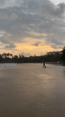 Surfers and sunset watchers enjoy cloudy afternoon at Galle beach