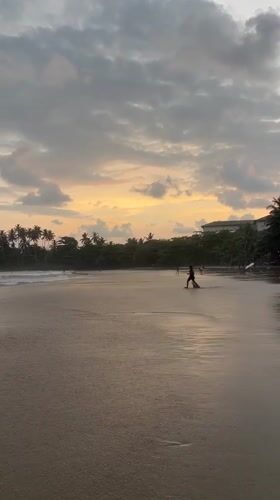 Surfers and sunset watchers enjoy cloudy afternoon at Galle beach