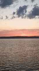 Sunset captured over calm waters with colorful sky