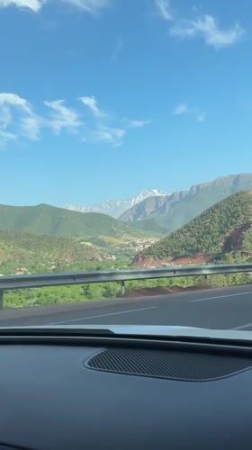 Driver records mountain scenery while traveling through Moroccan highlands