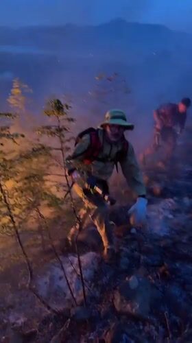 Wildfire spreads across hillside in Vranjina at dusk