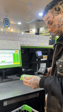 Evening shoppers navigate Buenos Aires supermarket checkout and aisles