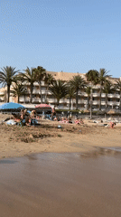 Crowded summer beach afternoon in Arona, Tenerife