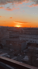 Vibrant sunset illuminates Saint Petersburg industrial skyline