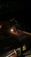 Fire dancers perform at nighttime beach party in Thailand