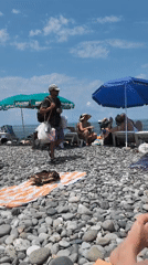 Summer morning on Batumi's busy pebble beach