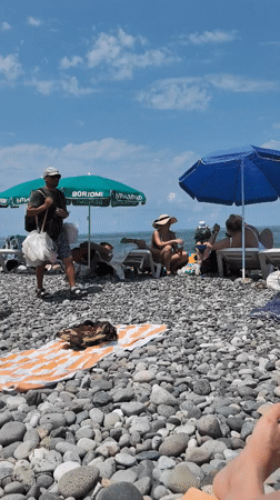 Summer morning on Batumi's busy pebble beach