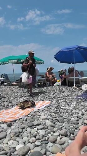 Summer morning on Batumi's busy pebble beach
