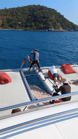 Catamaran crew pulls anchor in sunny Bang Sare waters