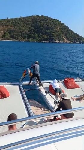 Catamaran crew pulls anchor in sunny Bang Sare waters