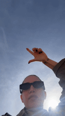 Tourist films selfie video at Great Pyramid of Giza