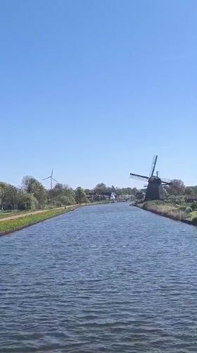 Peaceful canal scene documented in Alkmaar, Netherlands