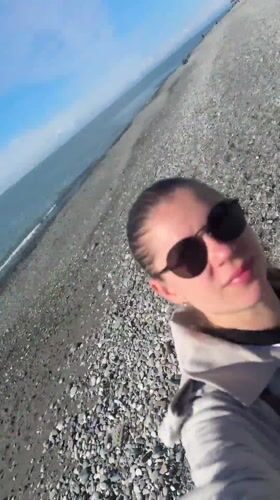 Woman takes selfie on sunny Batumi beach