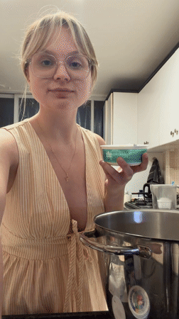 Woman bakes cake in Tel Aviv kitchen Friday afternoon
