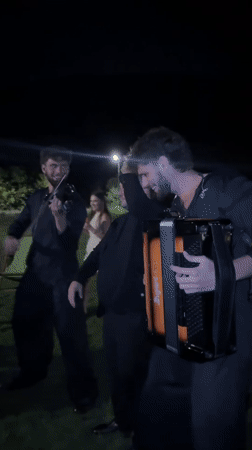 Live folk music and dancing at a nighttime outdoor gathering in Moldova