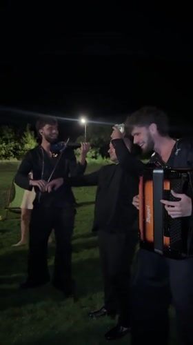 Live folk music and dancing at a nighttime outdoor gathering in Moldova