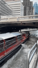 Central Bangkok at rush hour — river traffic, street congestion, city skyline