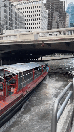 Central Bangkok at rush hour — river traffic, street congestion, city skyline