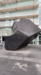 Skateboarders gather at Barcelona's MACBA plaza during overcast afternoon