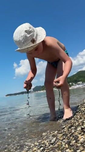 Child enjoys beach time on Russian coast