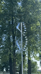 Person enjoys sunny day near kinetic sculpture in Votkinsk