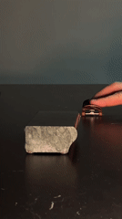 Person practices fingerboard tricks indoors in Yekaterinburg