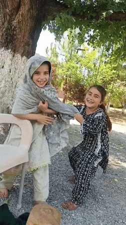 Family playtime captured in Pakistan morning hours