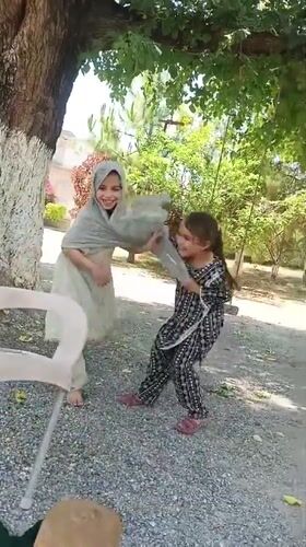 Family playtime captured in Pakistan morning hours