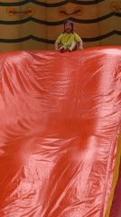 Dragon inflatable slide in action at Kirovsk outdoor play area