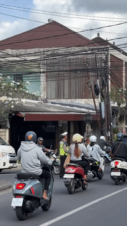 Morning traffic flows through busy Ubud streets