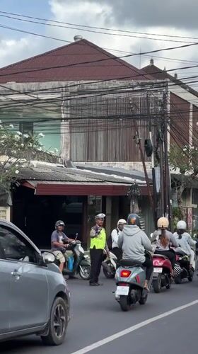 Morning traffic flows through busy Ubud streets