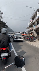 Motorcycle POV through Gondosuli traffic on a cloudy morning