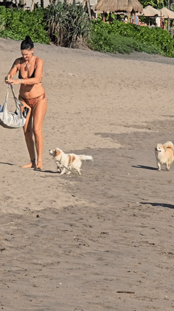 Man enjoys wine on North Kuta beach Sunday morning