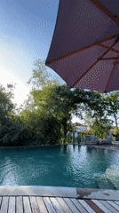 Poolside relaxation captured in sunny North Kuta, Indonesia