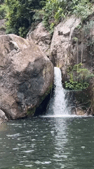Tranquil waterfall pool in the forests near Đà Nẵng