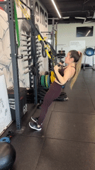 Woman performs TRX workout at Sofia gym