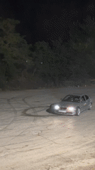 Cars and bikes drift a dark lot in Veliko Tarnovo