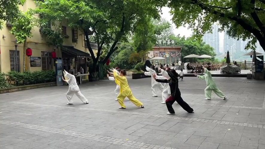 Morning Tai Chi, construction work captured in Chongqing district