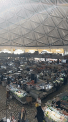 Market activity documented under geometric dome in Tashkent