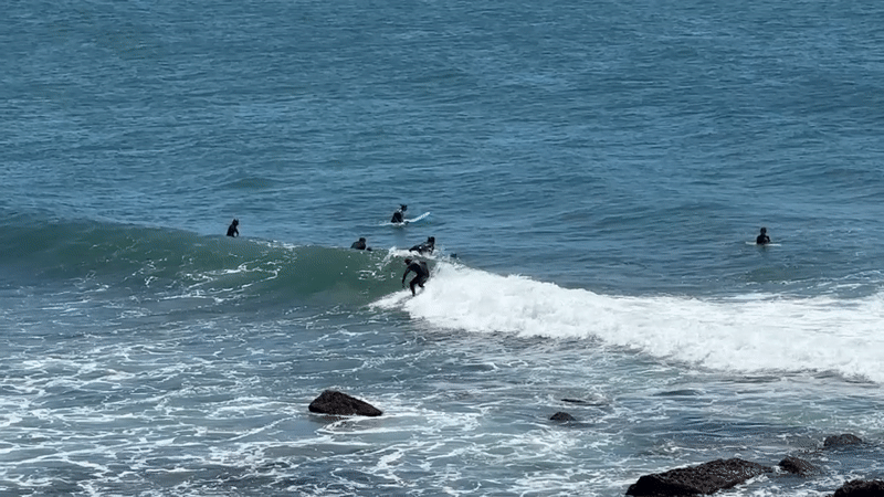 Surfer wipes out on waves near Cascais, Portugal beaches