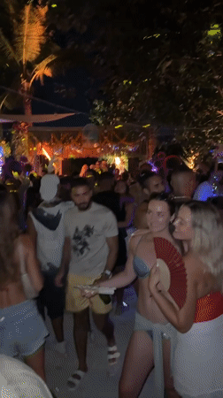 Nighttime beach party documented in Mengwi, Indonesia