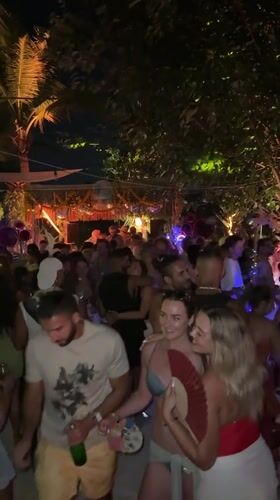 Nighttime beach party documented in Mengwi, Indonesia
