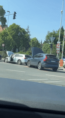 Two-car collision damages vehicles in Prague during daylight hours