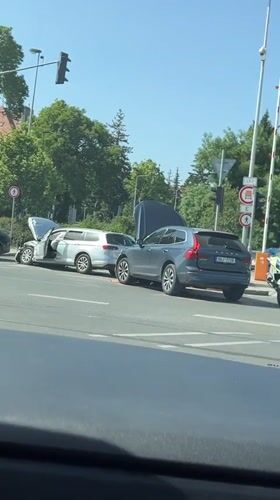 Two-car collision damages vehicles in Prague during daylight hours