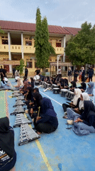 Outdoor marching band and dance rehearsal on a school court