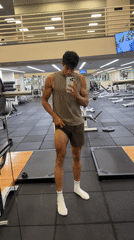 Young man records workout selfie in Los Angeles gym