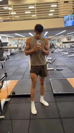 Young man records workout selfie in Los Angeles gym