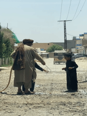 Daily life scenes in Kandahar: water play and bakery