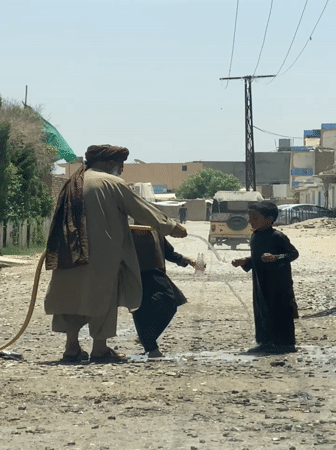 Daily life scenes in Kandahar: water play and bakery
