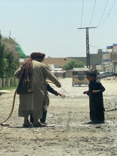 Daily life scenes in Kandahar: water play and bakery
